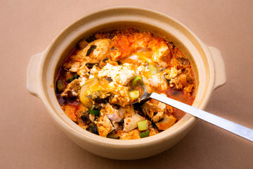 Korean spicy silken tofu stew which is called Sundubu Jjigae