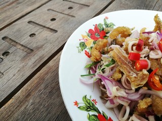 Yam pla salit real image of authentic organic asian cuisine, Thai spicy deep fried fish and mixed...