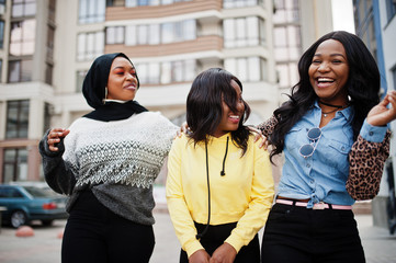 Three young college african american woman friends spend time together.