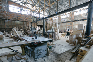 Confident woman working as carpenter in her own woodshop