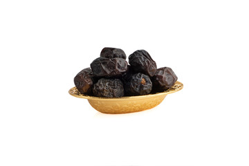 Ajwa Dates fruits or dry dates isolated on white background.Ramadan Kareem Breaking the fast by eating Tamar Dates