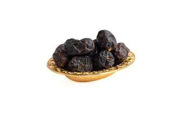 Ajwa Dates fruits or dry dates isolated on white background.Ramadan Kareem Breaking the fast by eating Tamar Dates