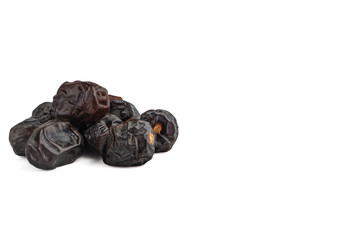Ajwa Dates fruits or dry dates isolated on white background.Ramadan Kareem Breaking the fast by eating Tamar Dates
