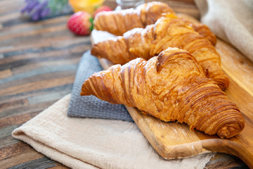 Delicious fresh croissant on table