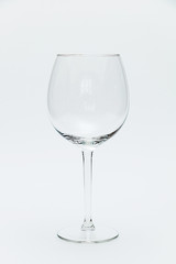 Empty wine glass on a white background.