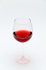 Glass of red wine on a white background