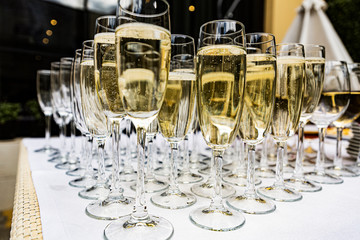 Many champagne glasses on the wedding table