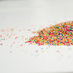 Colourful Sugar sprinkles, decoration for cake and ice-cream and cookies. Top view, Flat lay on white background.