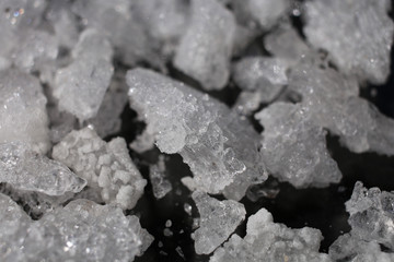 The structure of white crystals of potassium nitrate of irregular shape.