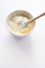 Preparation of savoiardi biscuits , step by steps visual recipe, whipped eggs white are mixed with eggs yolk gently with a spatula
