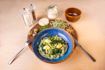 cooked pasta in a plate on a wooden board in the studio