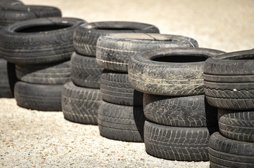 Safety barrier made of used tires inside a driving school polygon