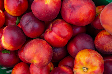 Heap Of Fresh Ripe Organic Peaches at fruit and vegetables Street Market organic ecological food from local producers