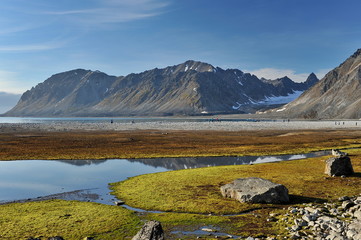 Reflection of the Svalbard mountains in the lake.