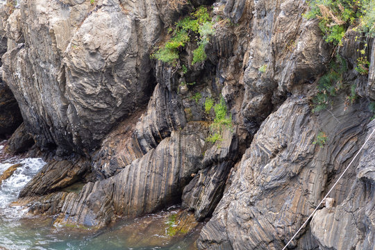 Stone wall rock in ocean water