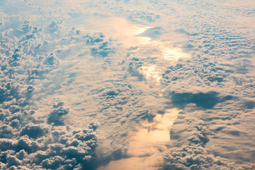 Sunrise above clouds and sea from airplane window. Natural background.