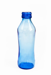 glass blue bottle with an iron lid on a white background