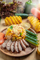 Pineapple fried rice In a wooden dish ,Thailand food, cooking