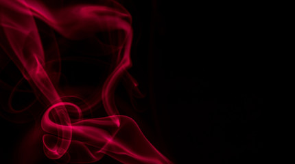 Red smoke on black background