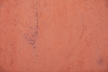 Background with red old paint on wood