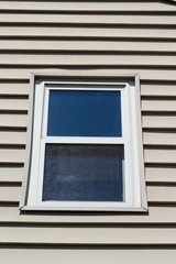 A close view of the window on the house.