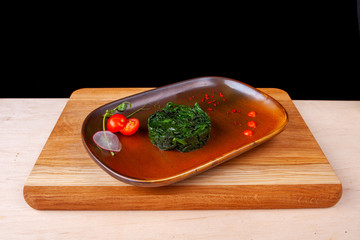 restaurant dish on a plate and ingredients that it includes