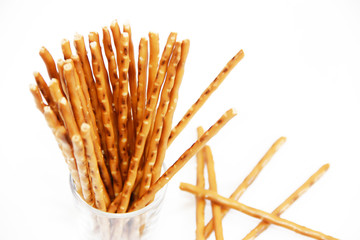 edible snack dry sticks with salt on a white background