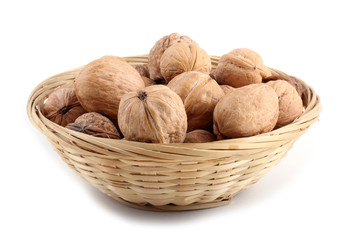 Walnuts on wicker plate