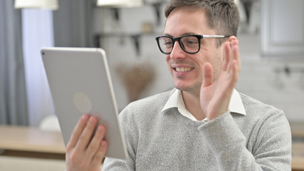 Online Video Chat on Tablet by Young Man
