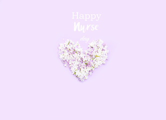 A heart of lilac flowers on a light background, and the inscription happy nurse's day.