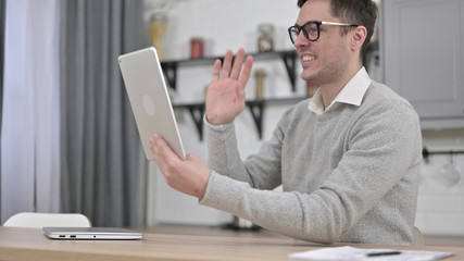Online Video Chat on Tablet by Young Man