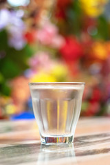 Glass of water with freshness colorful background.