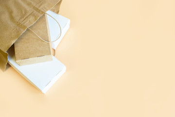 Delivery of food at home, in eco boxes and packages on a light background.
