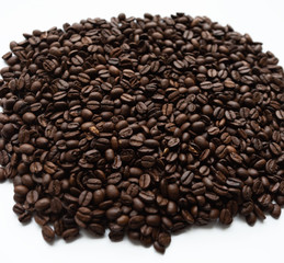 Coffee beans lying on white isolated background