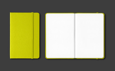 Lime green closed and open notebooks isolated on black