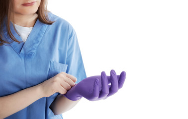 Medical stuff putting on protective gloves