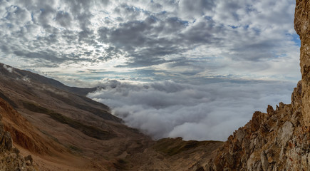 Beautiful mountain landscape. Atmospheric fog shrouds the mountains.