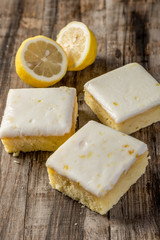 homemade lemon cake in squares on wood