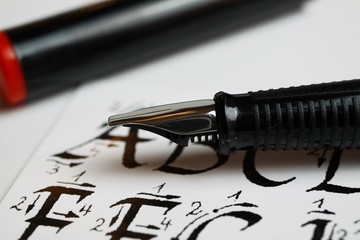 Viersen, Germany - April 30. 2020: Handwriting and calligraphy learning concept: Macro closeup of...
