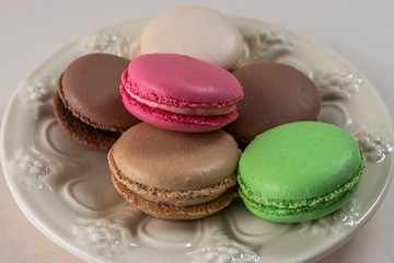 still life with saucer and colored macaroon cakes