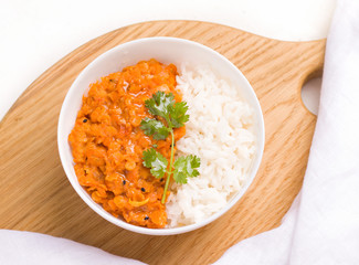 Dhal Indian vegetarian red lentil bean soup in Minsk close-up on a wooden board