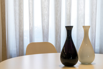 Modern black and white vases on table, modern furniture