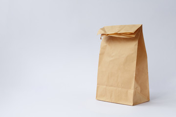 brown paper craft bag on a white background