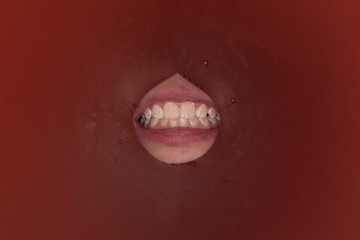 Naklejka premium human teeth in the hole