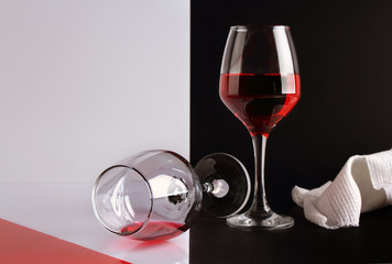 Two glasses of red wine on a black and white background