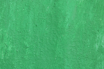 Fototapeta premium Beautiful vintage green background with old green paint with a rough surface, streaks and uneven texture of green paint on an old rough surface