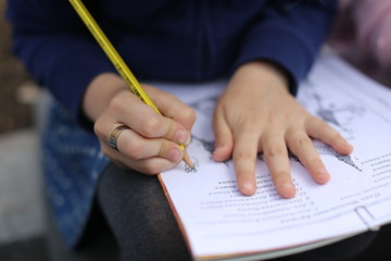 close up of hand writing on a paper