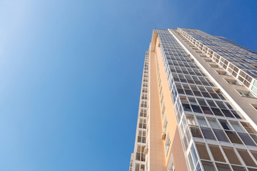 New tall house on a background of blue sky