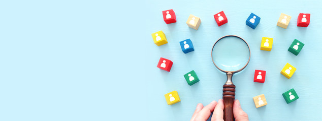 image of colorful blocks with people icons over wooden table ,human resources and management concept