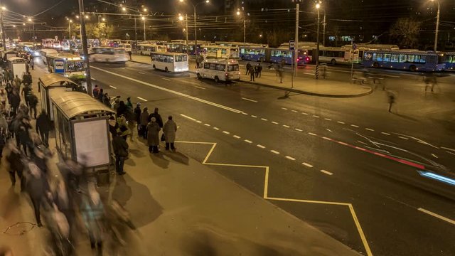 passengers waiting and boarding buses at the bus terminal, time lapse